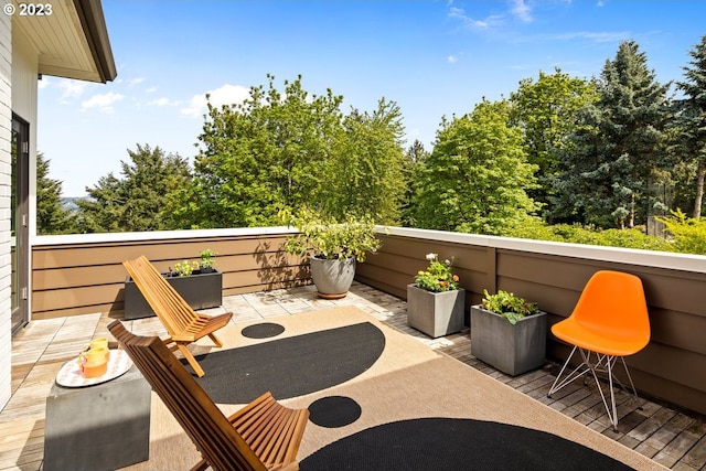 view of patio featuring a balcony