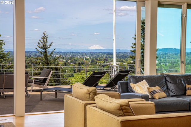 view of patio featuring a mountain view and a balcony