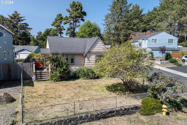 view of front of home with a front lawn