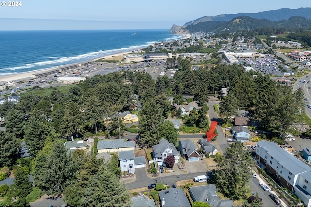 aerial view with a view of the beach and a water and mountain view