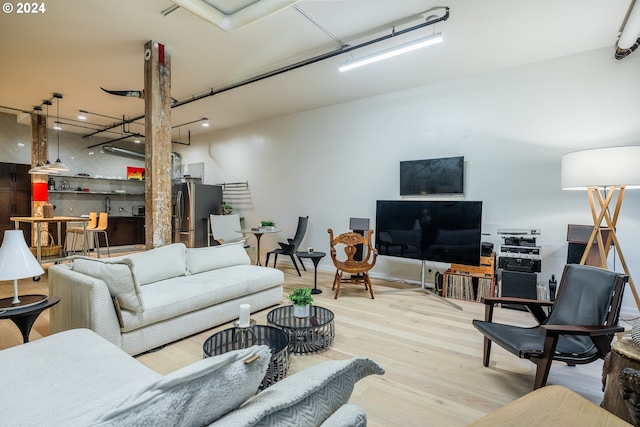 living room with light hardwood / wood-style floors