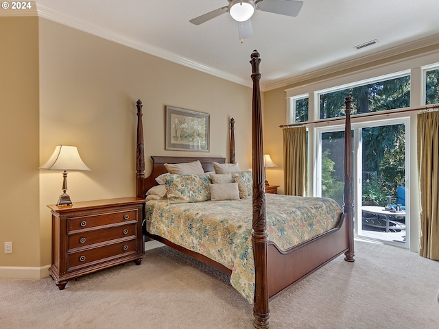 carpeted bedroom featuring access to outside, ornamental molding, and ceiling fan