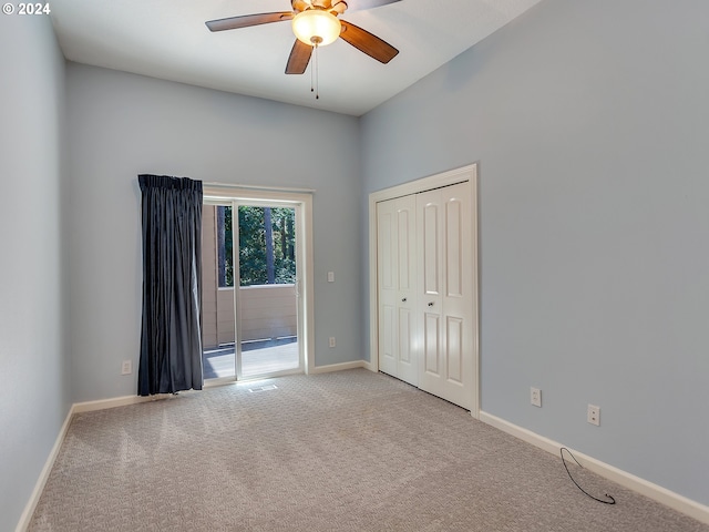 carpeted empty room with ceiling fan