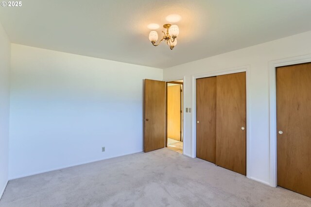 14940 SW 103rd Ave, Portland, OR 97224 - unfurnished bedroom featuring a notable chandelier and carpet