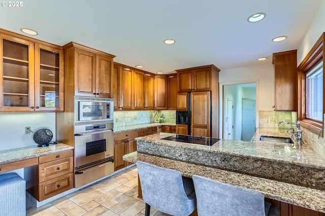 14940 SW 103rd Ave, Portland, OR 97224 - kitchen with built in appliances, recessed lighting, a peninsula, a warming drawer, and a sink