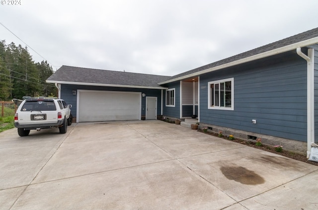 single story home with a garage