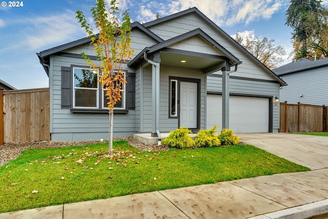 view of front facade with a garage and a front yard