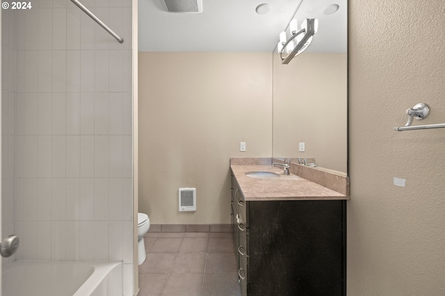 full bathroom featuring tile patterned flooring, vanity, toilet, and tiled shower / bath