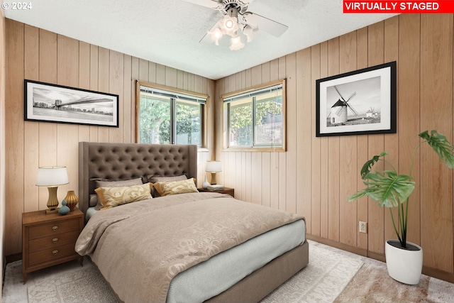 bedroom featuring ceiling fan and baseboards