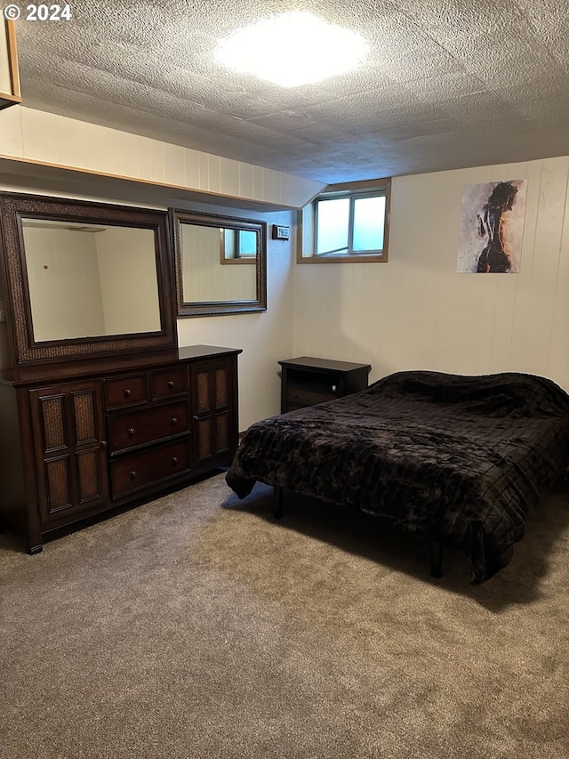 carpeted bedroom with a textured ceiling