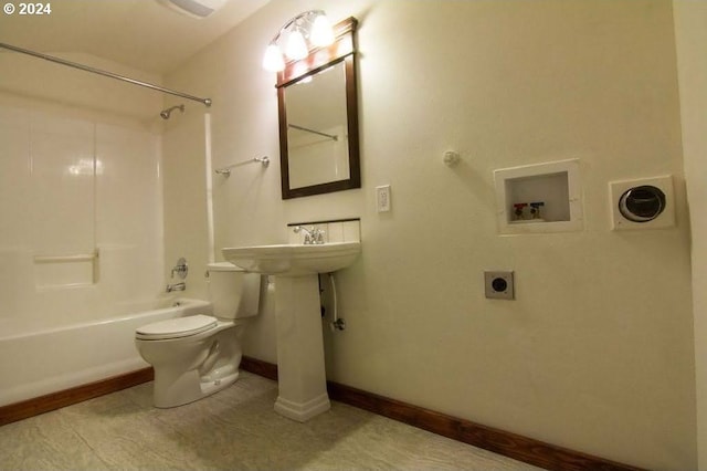 bathroom featuring tile patterned flooring, toilet, and shower / tub combination