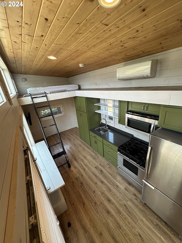 kitchen featuring an AC wall unit, wood-type flooring, wooden ceiling, green cabinets, and stainless steel appliances