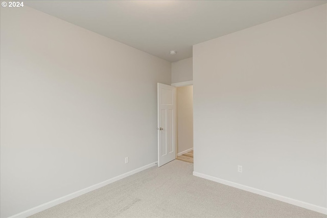 empty room with light colored carpet