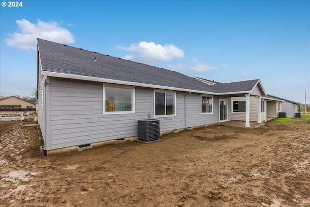 rear view of property with central air condition unit