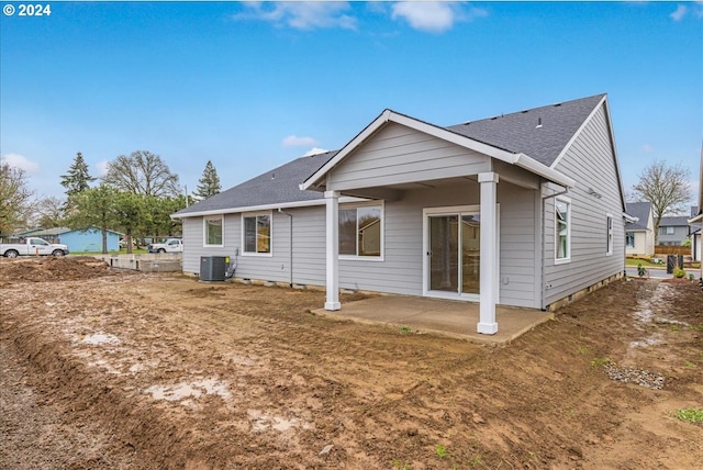 back of property featuring a patio and cooling unit