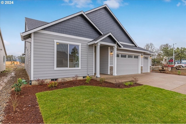 view of front facade featuring a front yard and a garage