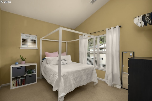 carpeted bedroom featuring lofted ceiling