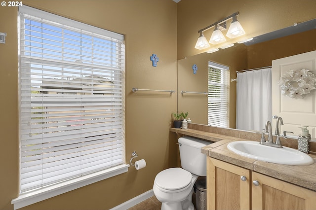 bathroom with vanity, toilet, and tile patterned flooring