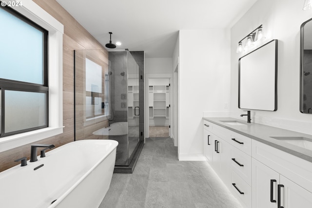 bathroom with vanity and plus walk in shower