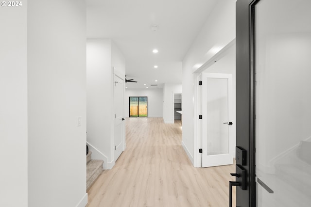 hall with light hardwood / wood-style flooring