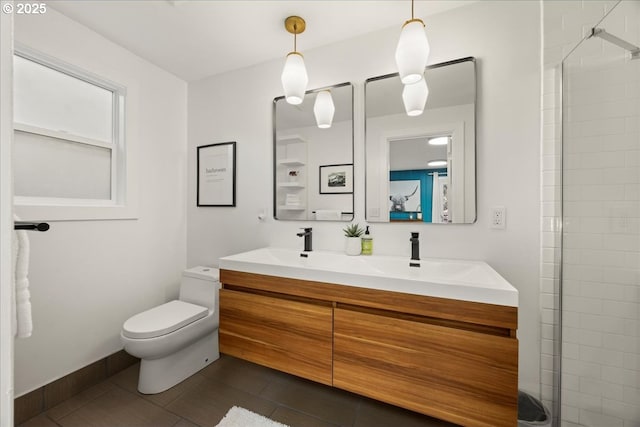 bathroom with vanity, a shower, and toilet