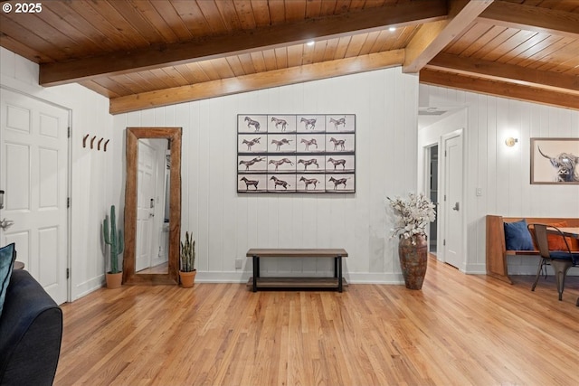 interior space with wood ceiling, vaulted ceiling with beams, light wood-style flooring, and baseboards