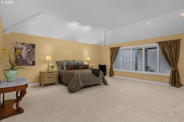 bedroom with light carpet and vaulted ceiling with beams