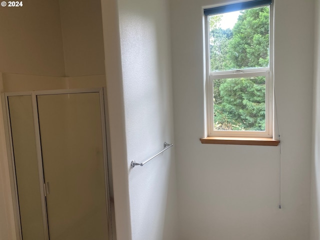 bathroom featuring a shower stall