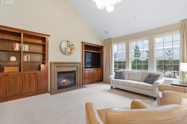 living room with high vaulted ceiling and light colored carpet