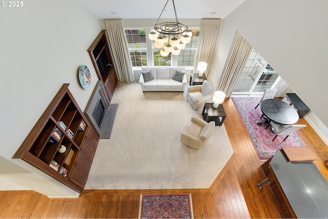 living room with a notable chandelier and hardwood / wood-style floors