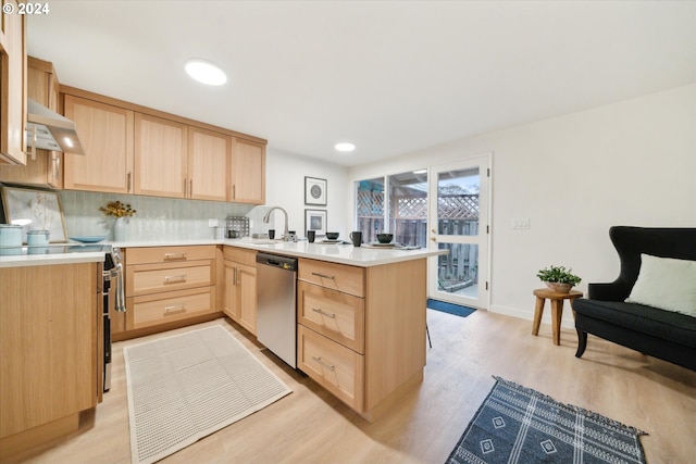 kitchen featuring light brown cabinetry, sink, kitchen peninsula, stainless steel appliances, and exhaust hood