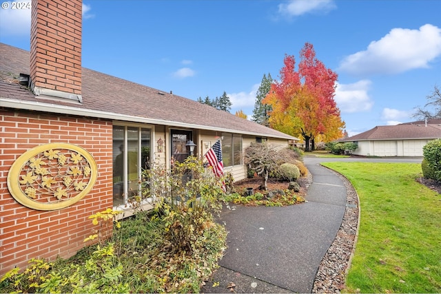 exterior space with a front lawn