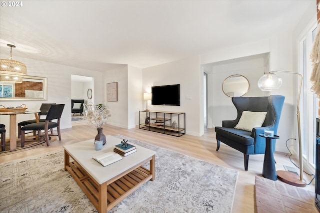 living room with light hardwood / wood-style flooring