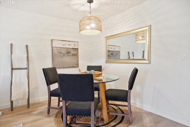 dining space featuring light wood-type flooring