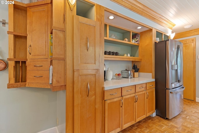 kitchen with crown molding, open shelves, light countertops, brown cabinetry, and stainless steel fridge