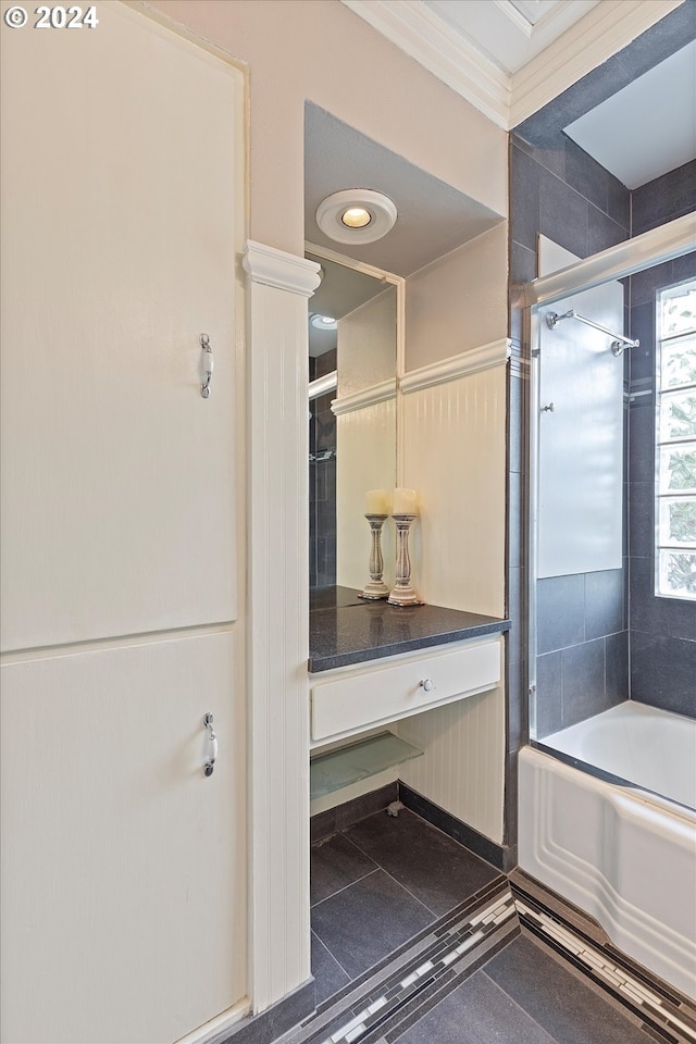 bathroom with shower / bathing tub combination and crown molding