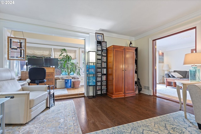 living room featuring dark hardwood / wood-style flooring and crown molding