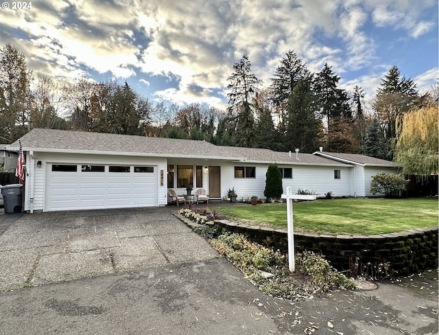 ranch-style house with a front lawn and a garage