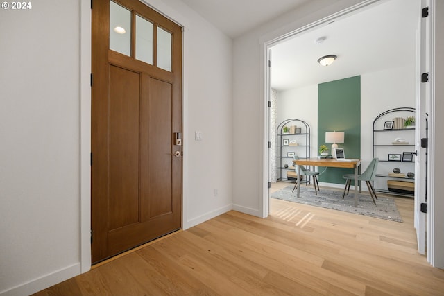 foyer entrance with wood-type flooring