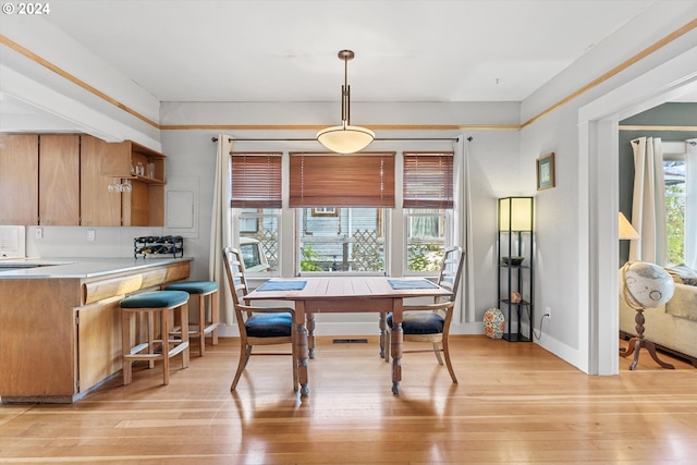 dining area with light wood-type flooring