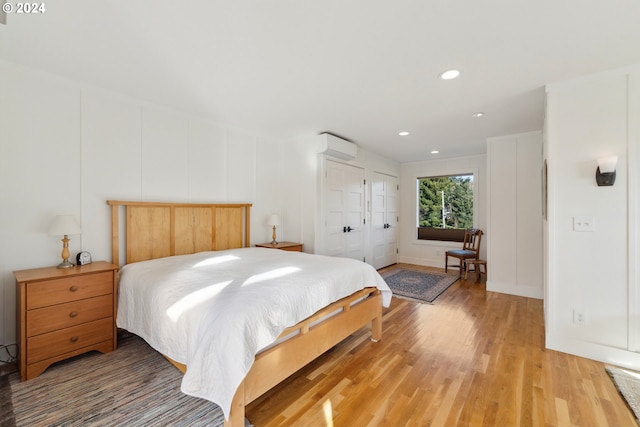 bedroom featuring hardwood / wood-style flooring and a closet