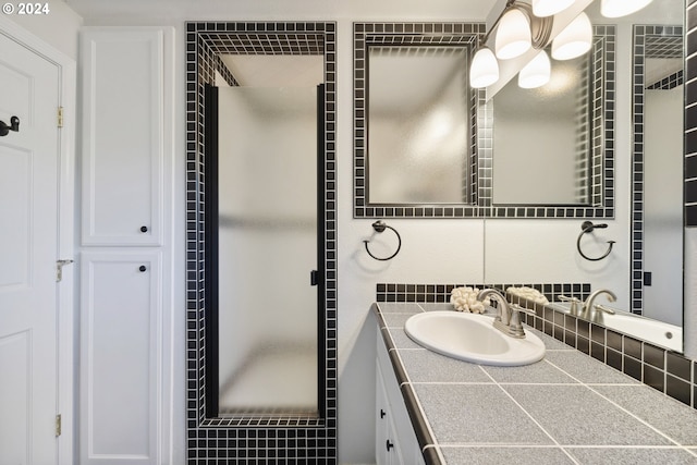 bathroom with vanity and backsplash