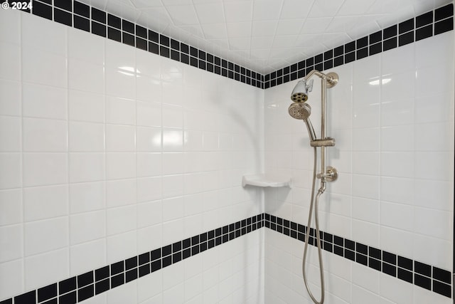 bathroom with a tile shower