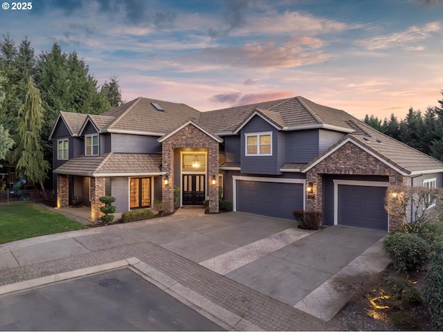 14960 SW Brooklet Pl, Portland, OR 97224 - view of front of home featuring stone siding and concrete driveway