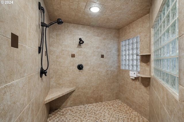 bathroom with tiled shower