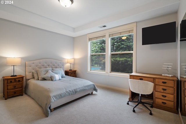 bedroom with light colored carpet