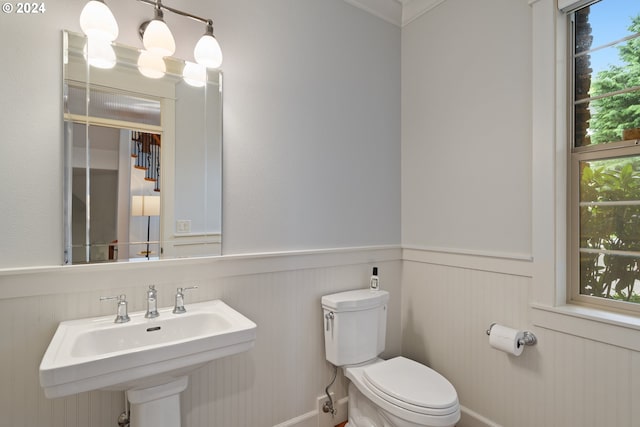 bathroom with plenty of natural light, sink, and toilet