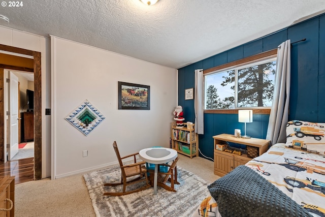 carpeted bedroom with a textured ceiling