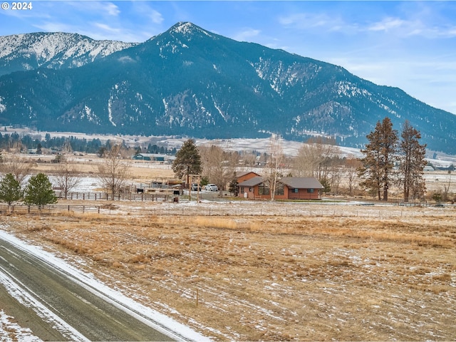 view of mountain feature with a rural view