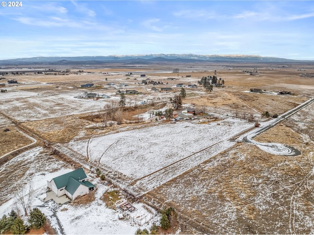 birds eye view of property featuring a mountain view and a rural view